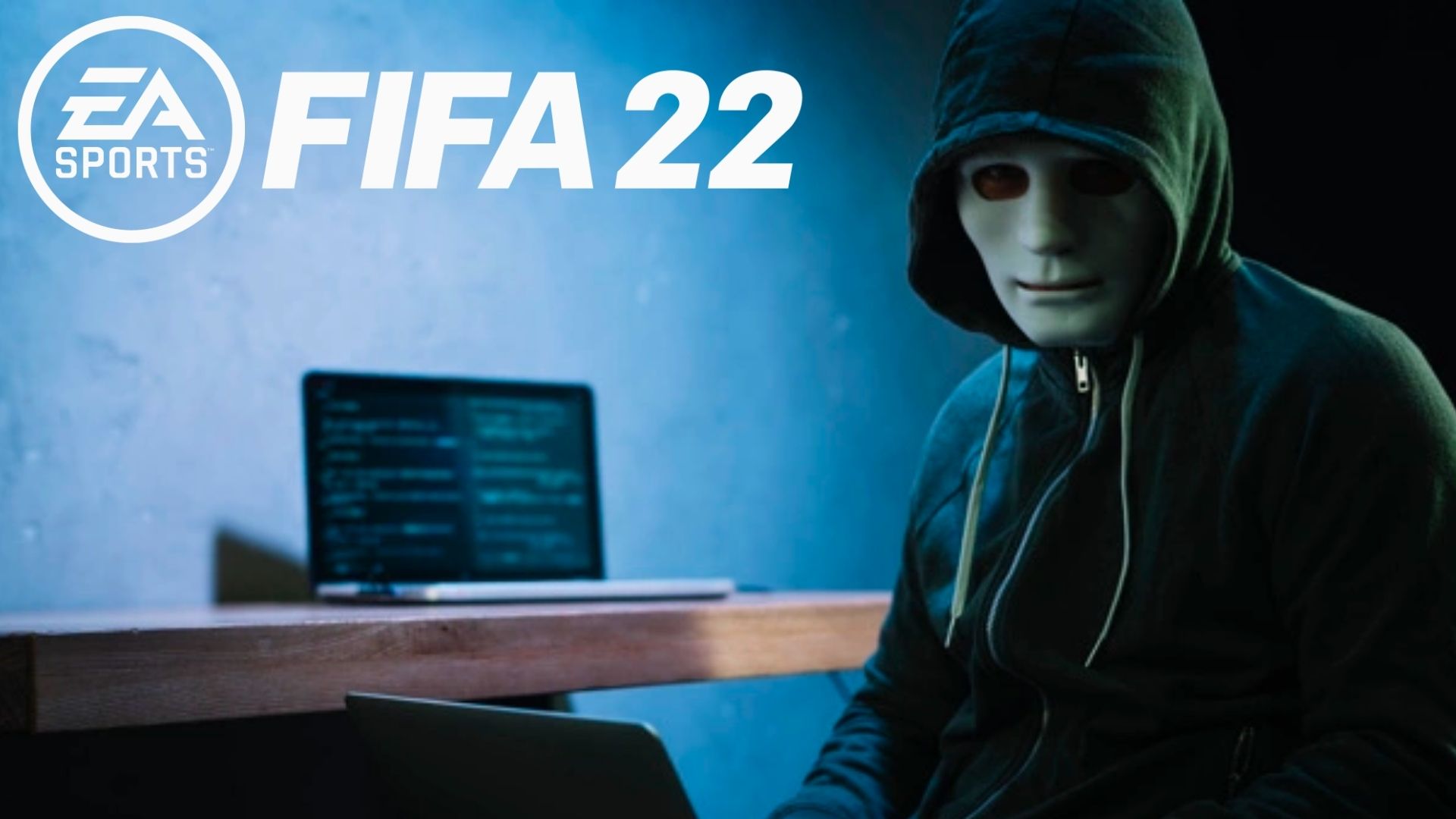 Masked hacker with computer next to FIFA 22 logo