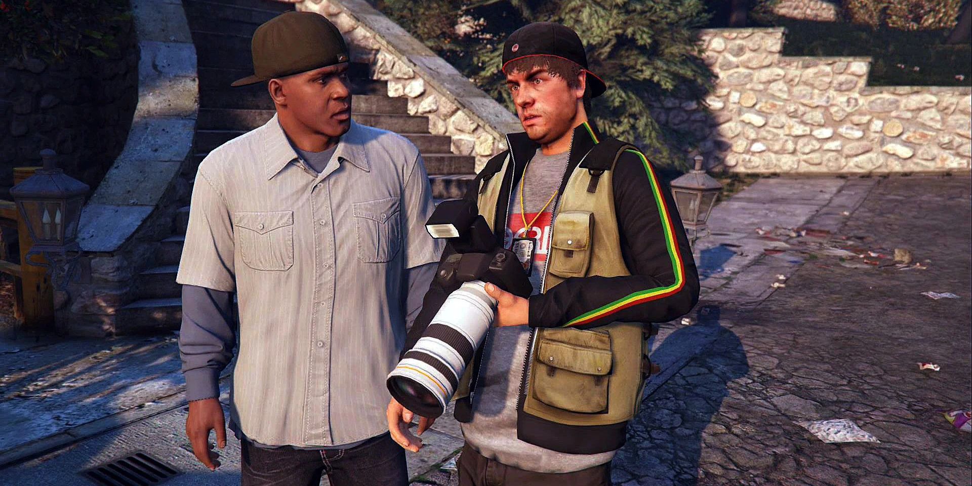 Franklin Clinton and Beverly Felton stood in a road, Felton holding a camera with a huge lens as Franklin stares at him