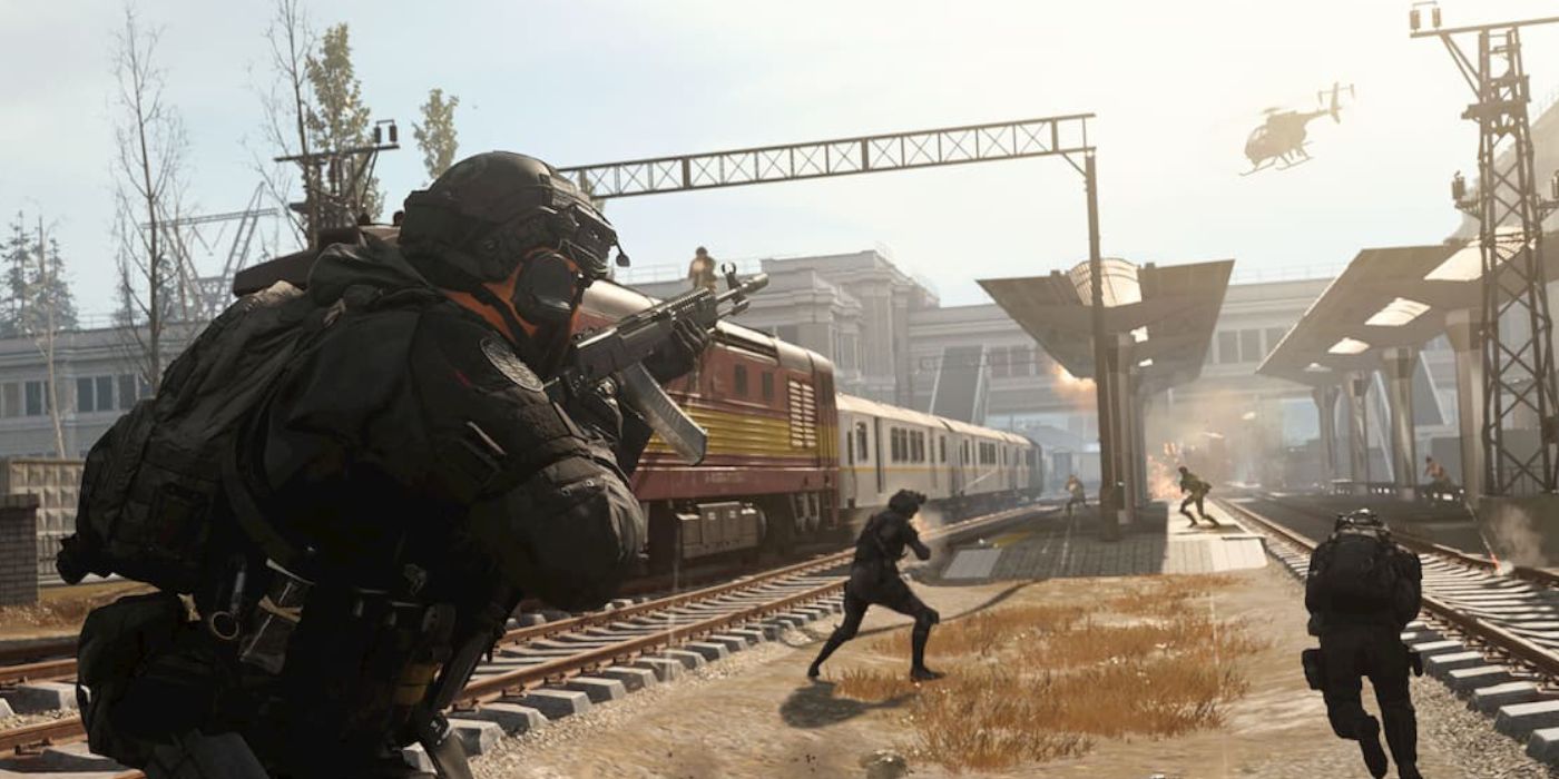Multiple Warzone 2 squads fighting in a train yard while a helicopter flies overhead.