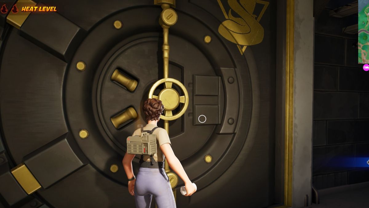 Fortnite - a player stands in front of a large col blooded vault door