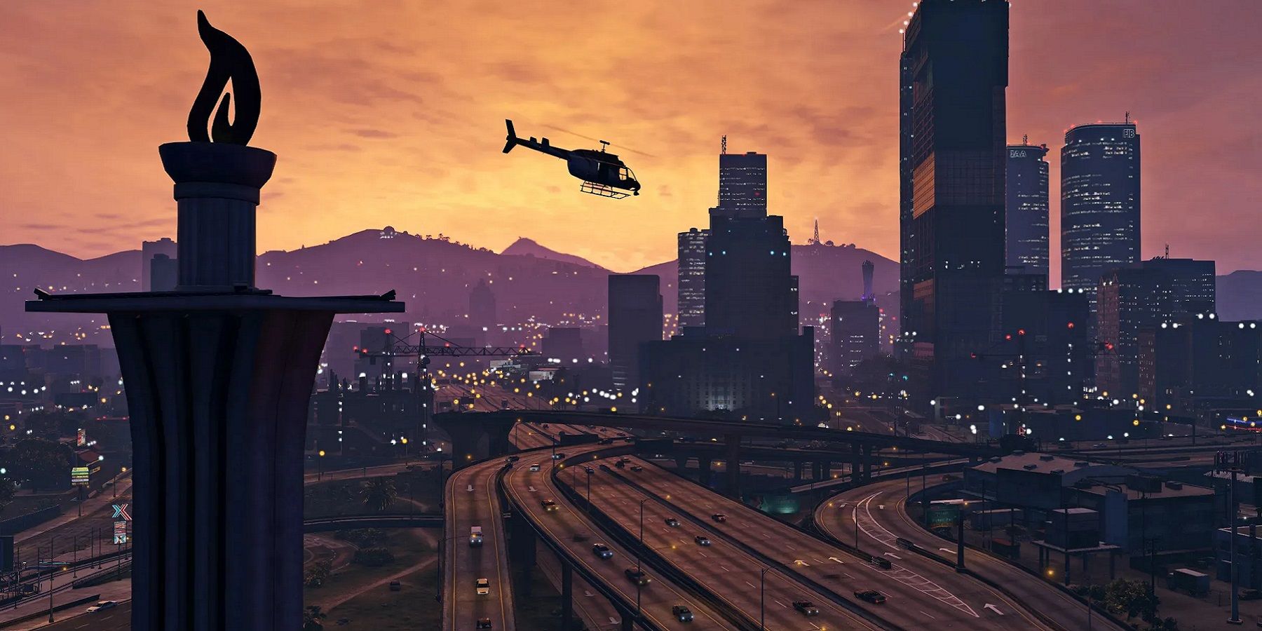 Wide-angle image from Grand Theft Auto 5 showing a helicopter flying over the city during a sunset..