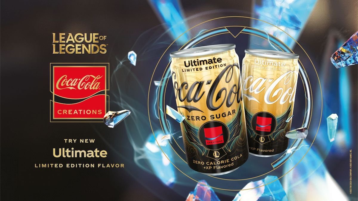 Two gold and black cans of Coca-Cola
