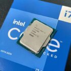 An Intel Core i7-13700K against its retail packaging