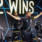 G2's CS:GO captain celebrates after they won a match at IEM Cologne in 2023. HooXi is with his arms wide open staring at the cameras.